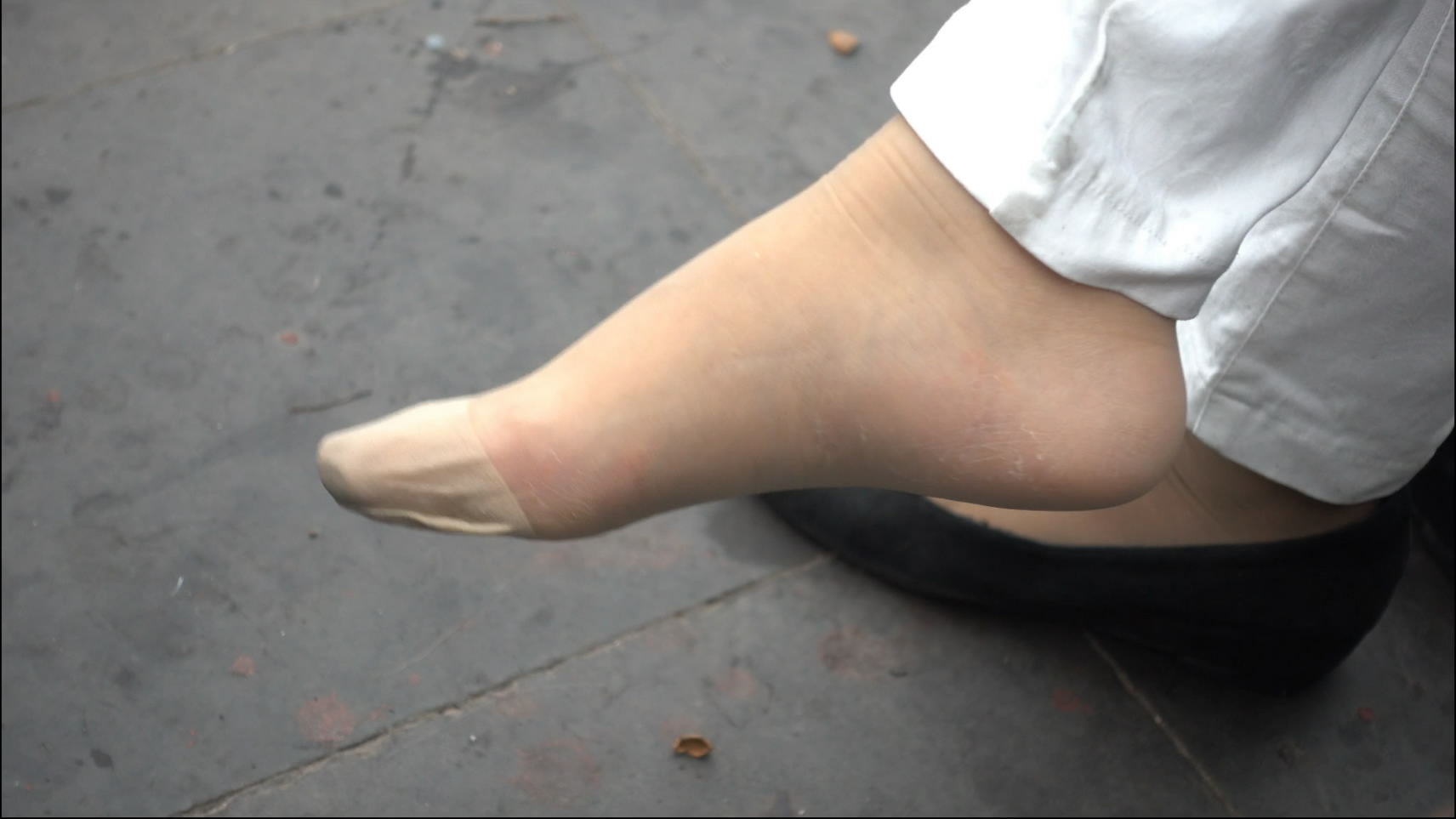 White trousers and nylon feet